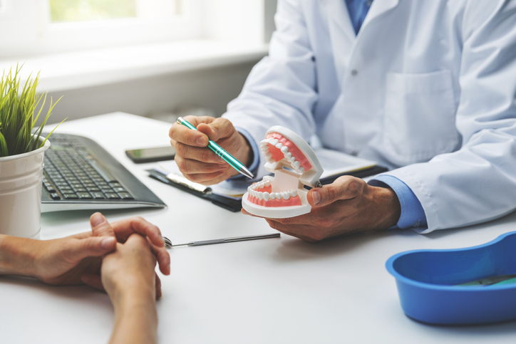 dentist discussing treatment with a patient