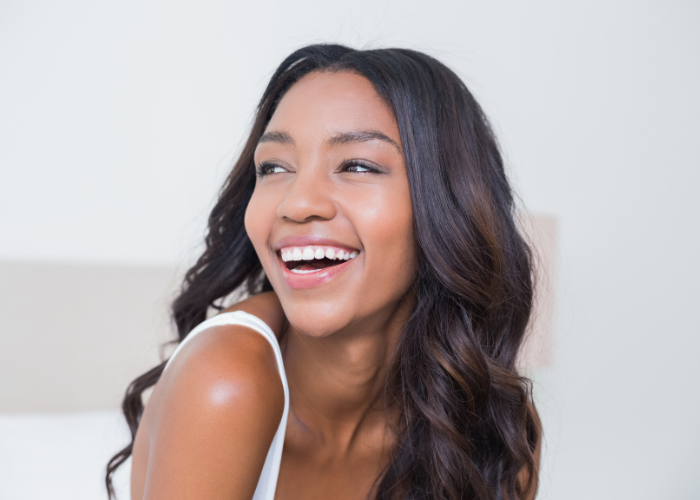 Woman smiling brightly.